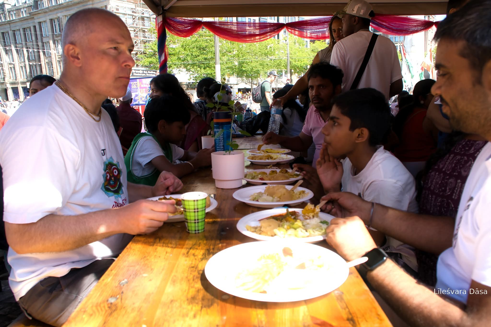 Volunteers serving free vegetarian prasadam at Ratha Yatra Amsterdam